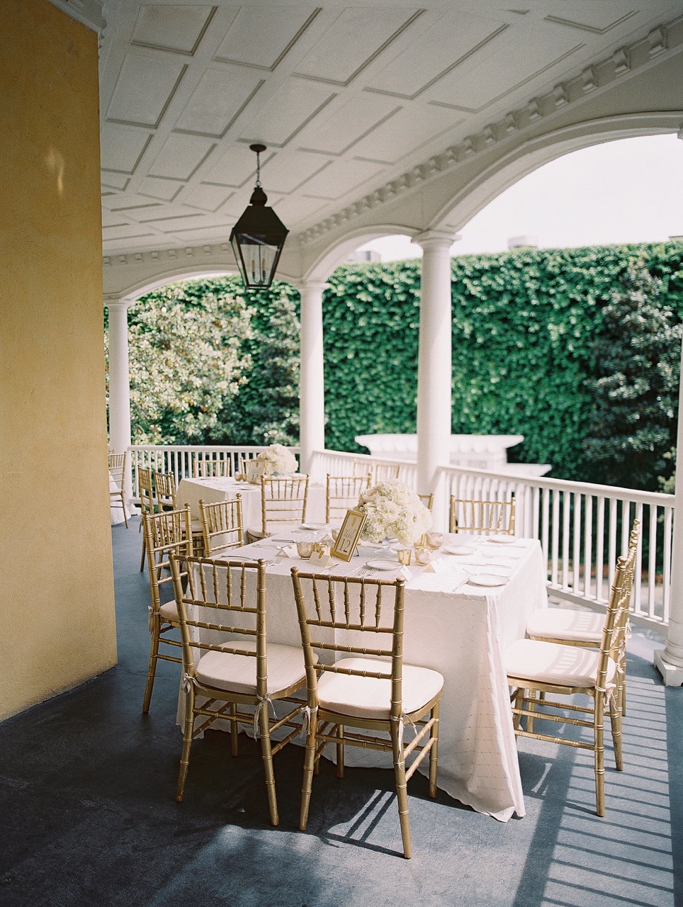Coastal veranda lounge with custom furniture and lanterns