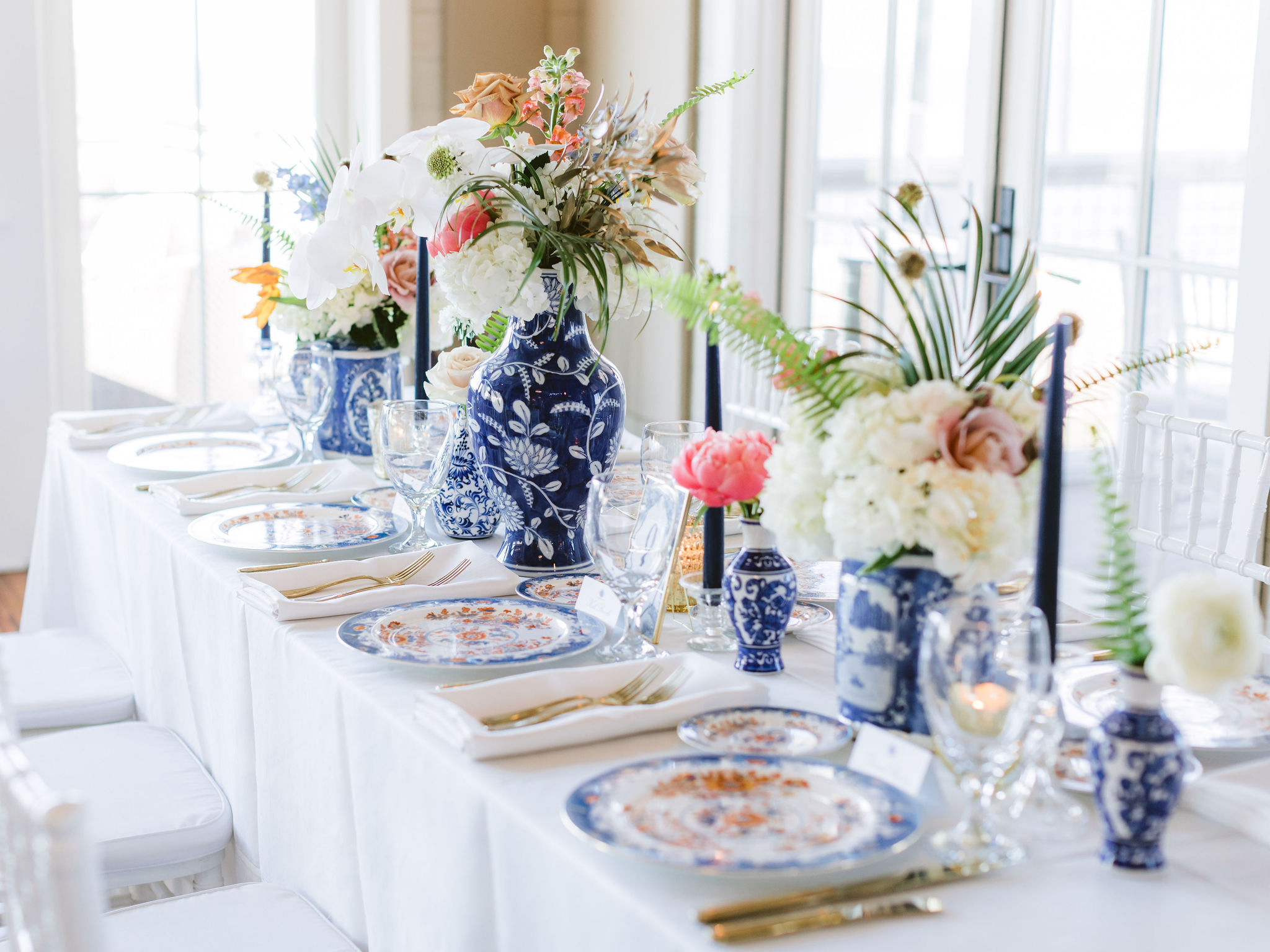 Blue-and-white tablescape with fine china and coastal details