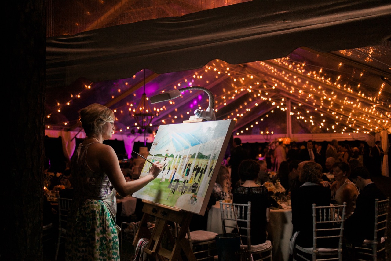 Tented celebration glowing under string lights at dusk